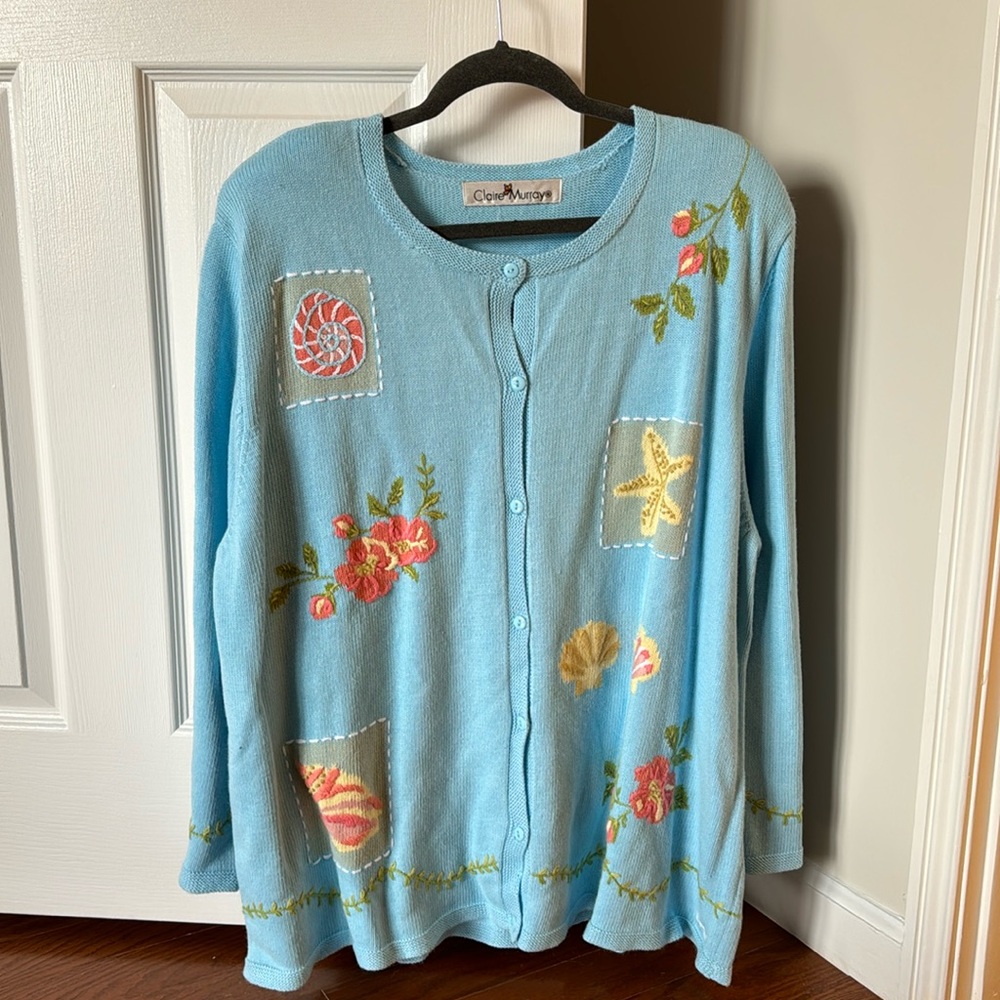 Baby blue button down sweater with detailing